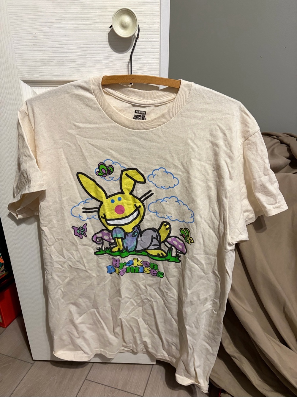 Broken Promises Cream Short Sleeve Graphic Tee with Yellow Bunny